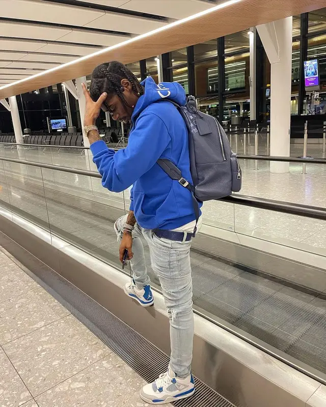 Russ Millions outfit in Celine, Amiri, and Louis Vuitton, 2021