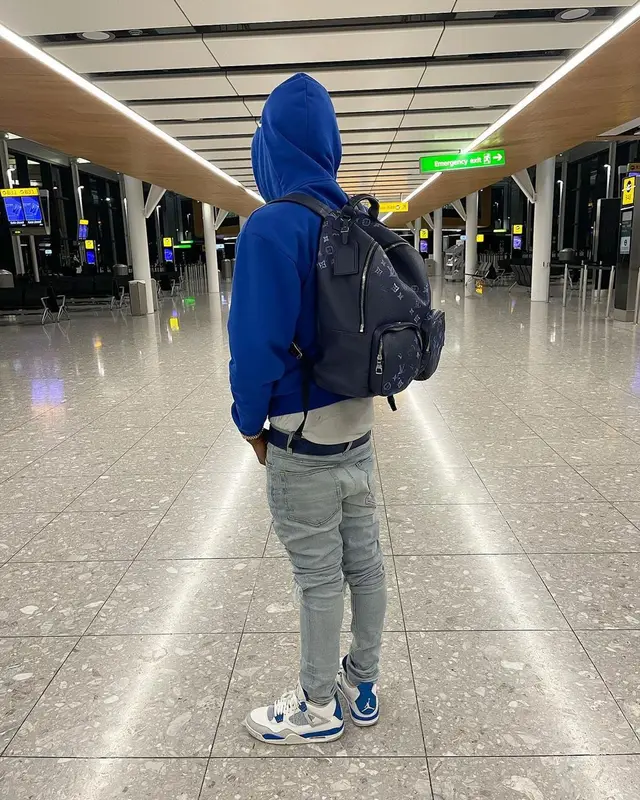 Russ Millions outfit in Celine, Amiri, and Louis Vuitton, 2021