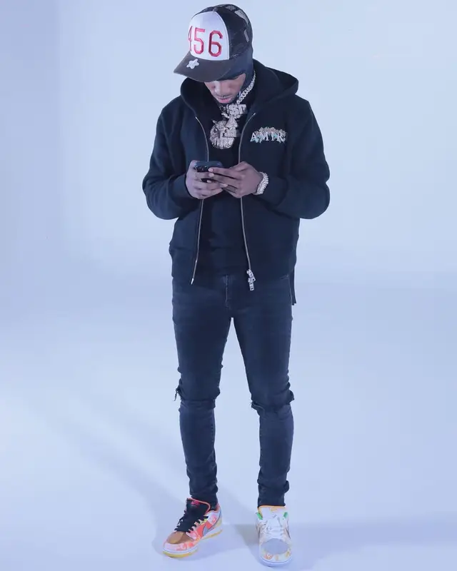 Toosii outfit in Amiri, Purple Brand, and Nike, 2021