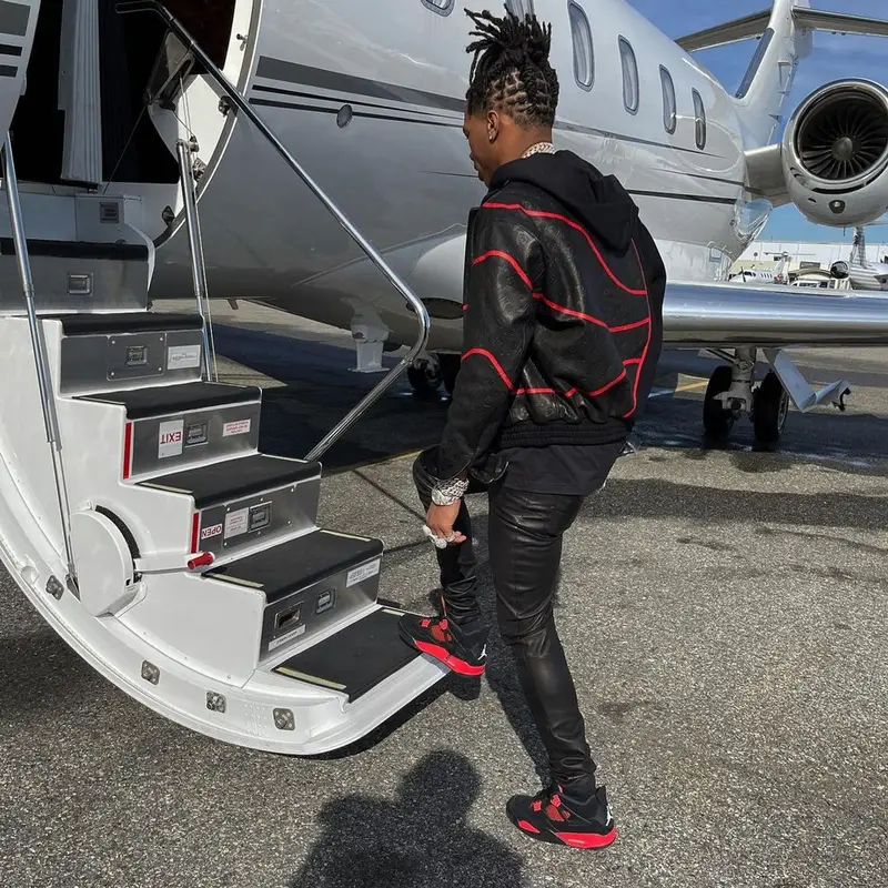 Lil Baby outfit in Louis Vuitton, Amiri, and NBA, 2021