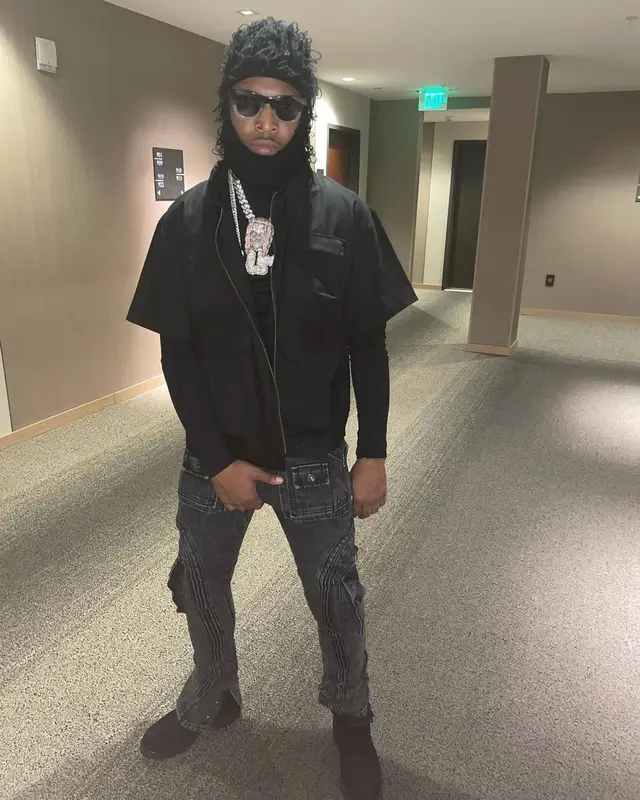 Lil Keed outfit in Ryan Knew, Timberland, and Greedy Unit, 2021
