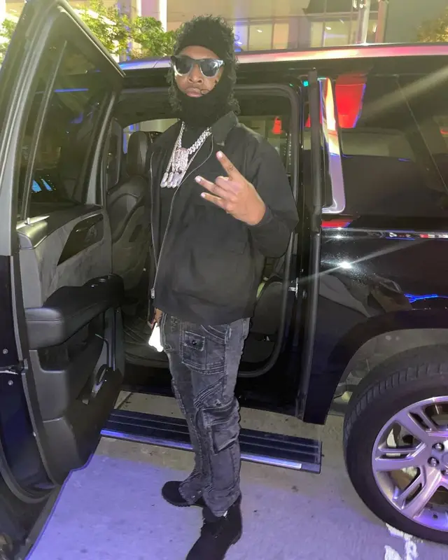 Lil Keed outfit in Ryan Knew, Timberland, and Greedy Unit, 2021