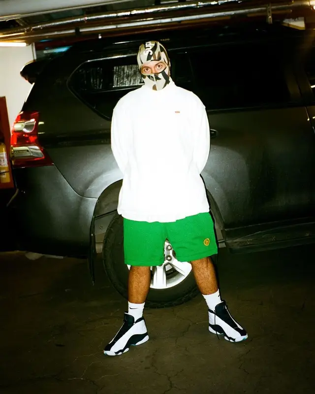 Feid outfit in Hidden, Supreme, and Nike, 2021
