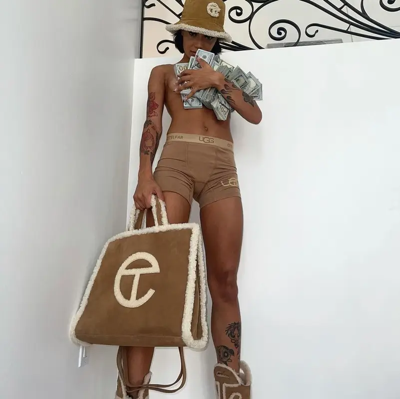 Coi Leray outfit in Who Decides War, Ugg, and Telfar, 2021