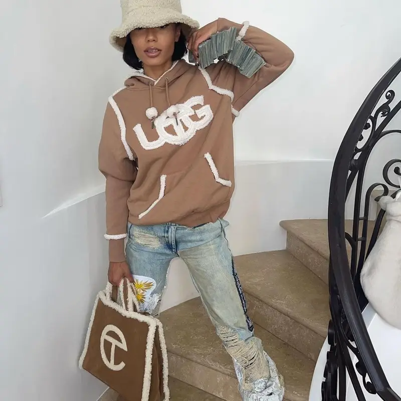 Coi Leray outfit in Who Decides War, Ugg, and Telfar, 2021