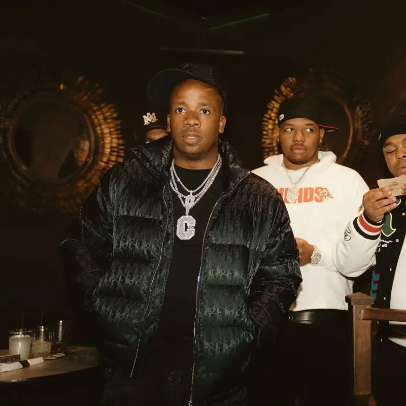 Yo Gotti outfit in Dior, Chemist, and Amiri, 2021