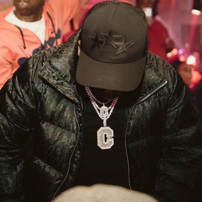 Yo Gotti outfit in Dior, Chemist, and Amiri, 2021