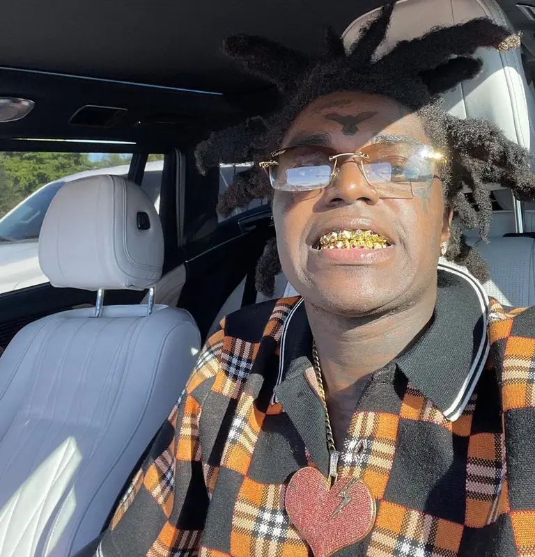 Kodak Black outfit in Burberry, Amiri, and Cartier, 2021