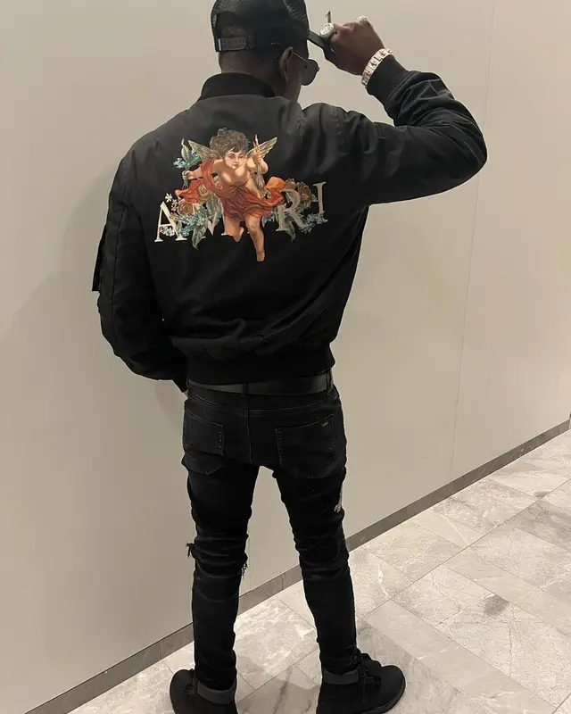 Bobby Shmurda outfit in Louis Vuitton, Dior, and Amiri, 2021