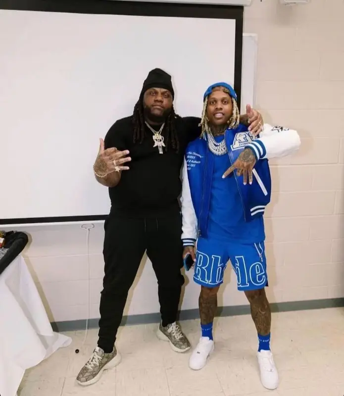 Lil Durk outfit in Avirex, Rhude, and Balenciaga, 2021