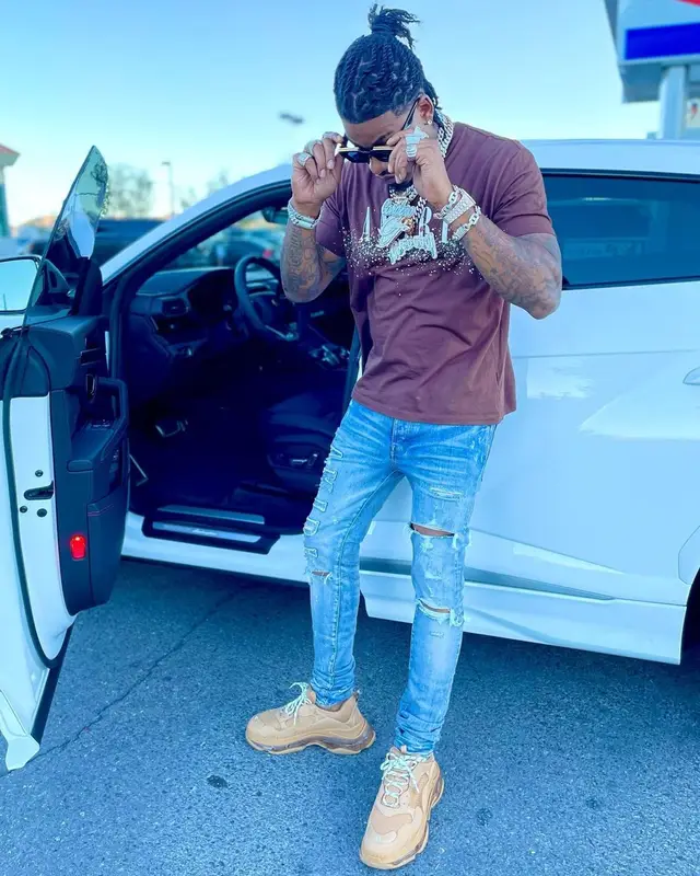 CJ So Cool outfit in Amiri, Balenciaga, and Louis Vuitton, 2021