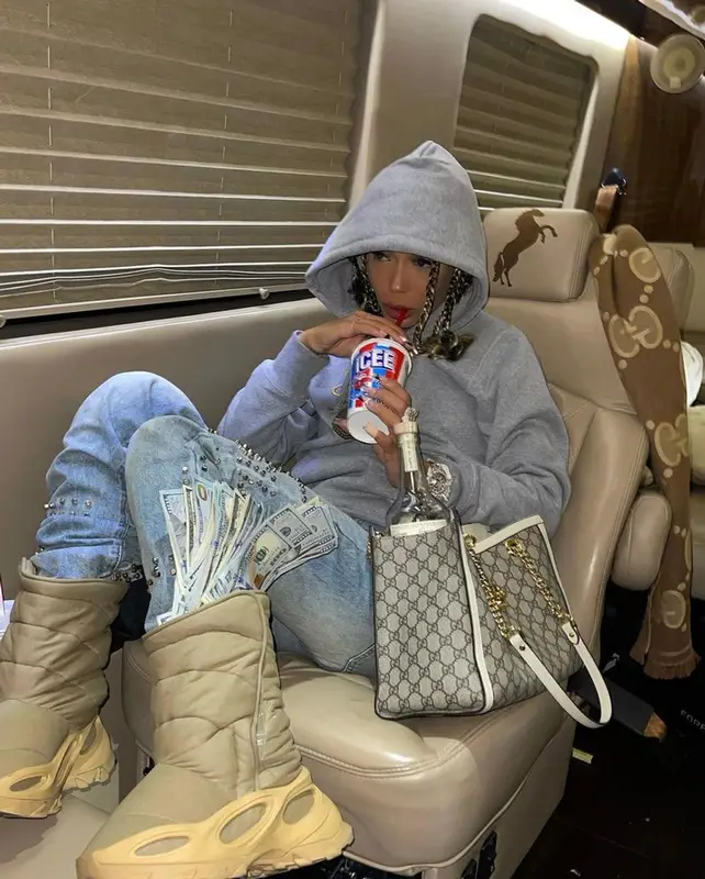 Coi Leray outfit in Bape, Gucci, and OVO, 2021