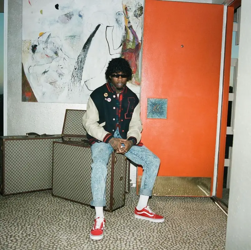 Tory Lanez outfit in Custom, Louis Vuitton, and Wrangler, 2021