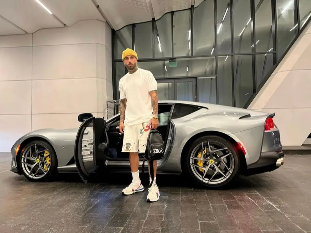 Nicky Jam outfit in Christian Sex Club, Nike, and Dior, 2021