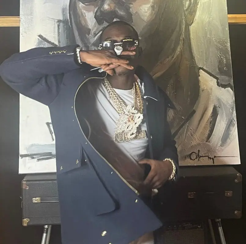 Bobby Shmurda outfit in Thom Browne, Amiri, and Polo Ralph Lauren, 2021