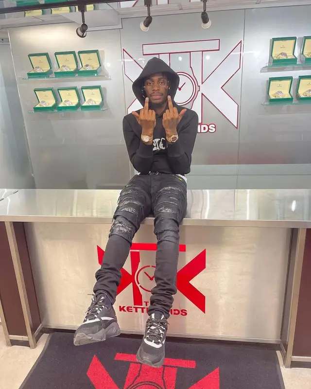Russ Millions outfit in Dior, Amiri, and Peter Doig, 2021