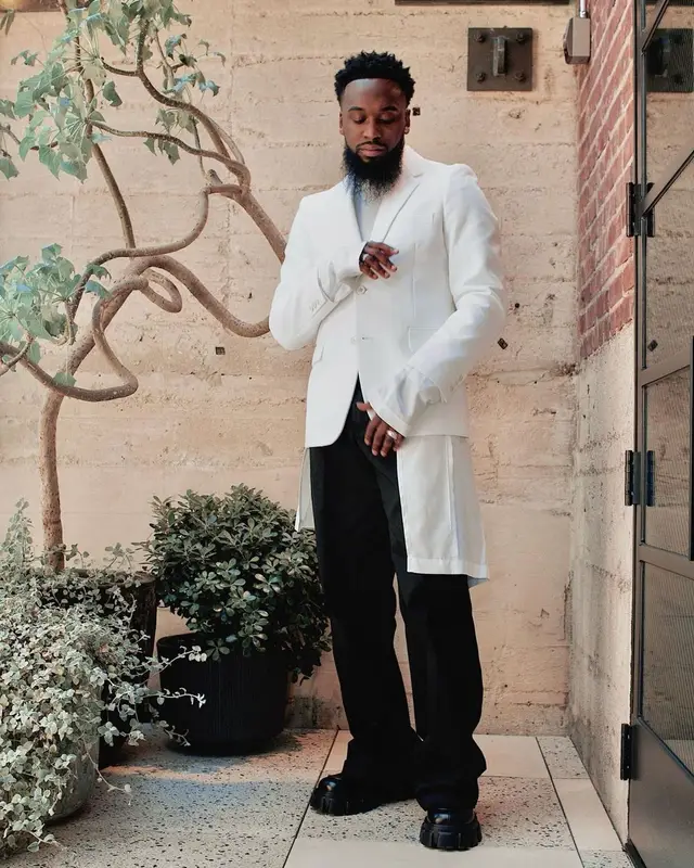 Dante Bowe outfit in Comme Des Garcons, Raf Simons, and Prada, 2021