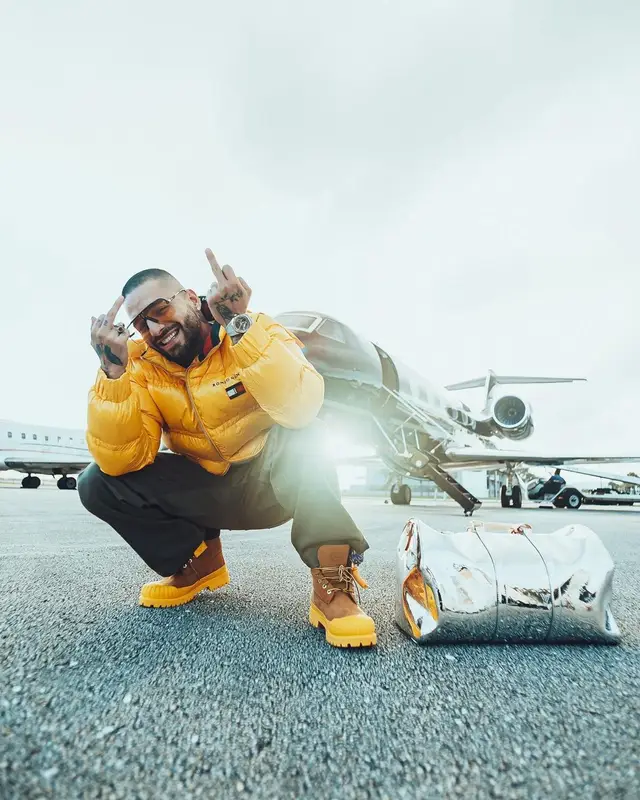 Maluma outfit in Tommy Hilfiger, Carrera, and Romeo Hunte, 2021