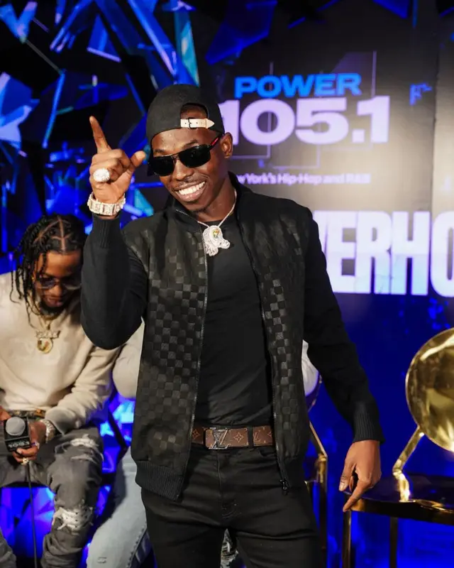 Bobby Shmurda outfit in Amiri, Prada, and Louis Vuitton, 2021