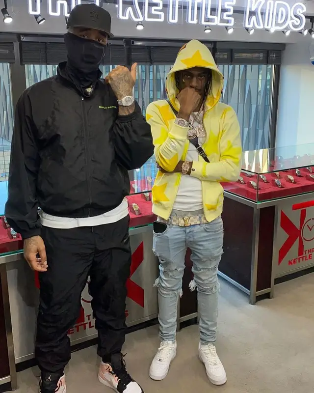 Russ Millions outfit in Bape, Amiri, and Louis Vuitton, 2021