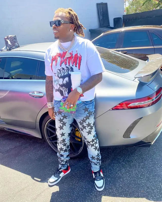 Gunna outfit in Amiri, Louis Vuitton, and Chemist, 2021