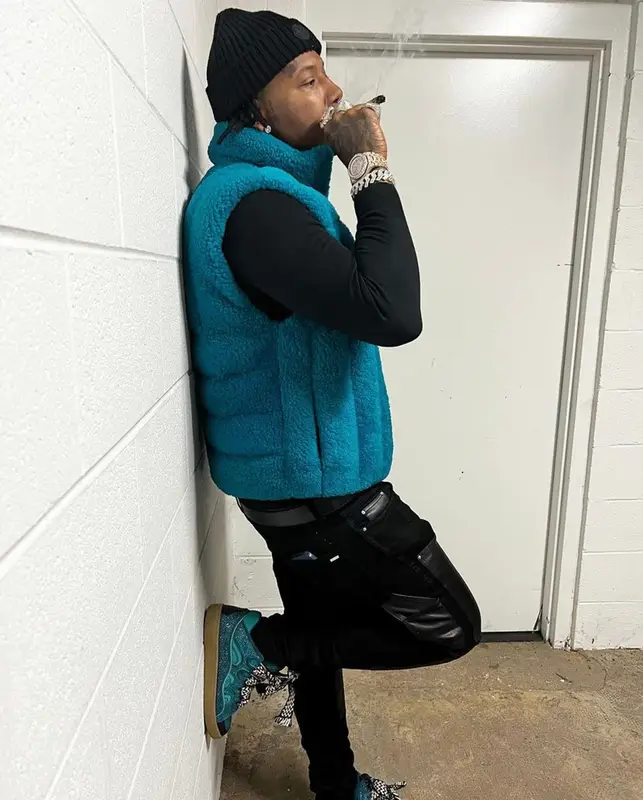 Moneybagg Yo outfit in Bottega Veneta, Louis Vuitton, and Moncler, 2021