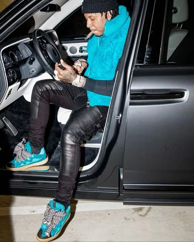 Moneybagg Yo outfit in Bottega Veneta, Louis Vuitton, and Moncler, 2021