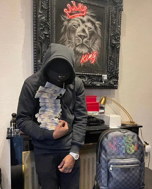 Lil Tjay outfit in Moncler, Amiri, and Prada, 2021