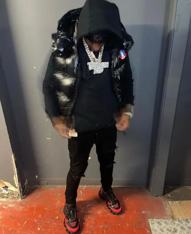 Lil Tjay outfit in Moncler, Amiri, and Prada, 2021