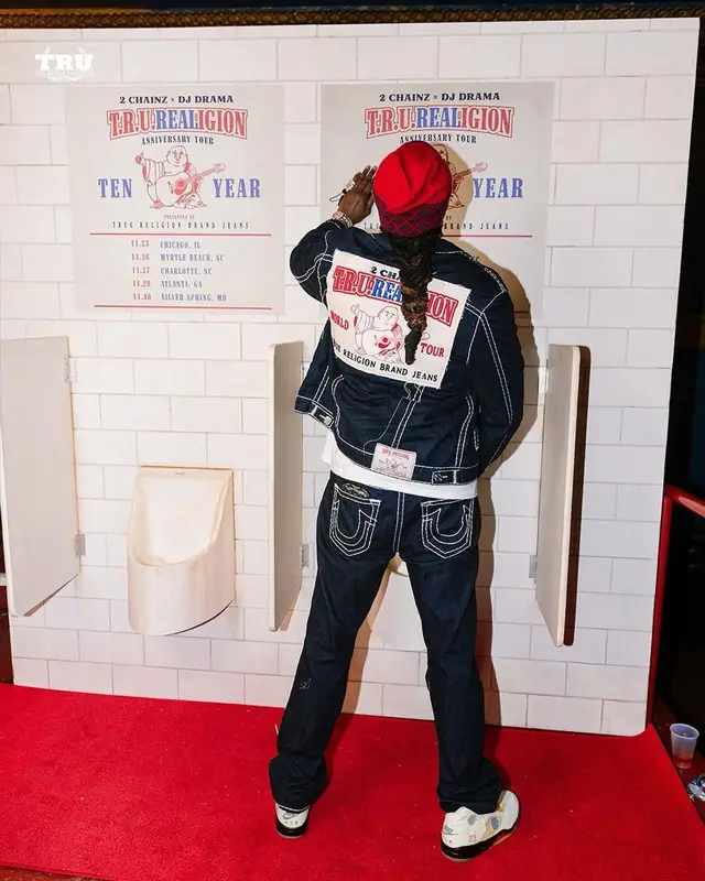 2 Chainz outfit in True Religion, Louis Vuitton, and 2 Chainz Merch, 2021