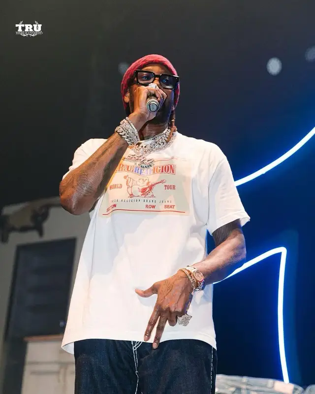 2 Chainz outfit in True Religion, Louis Vuitton, and 2 Chainz Merch, 2021