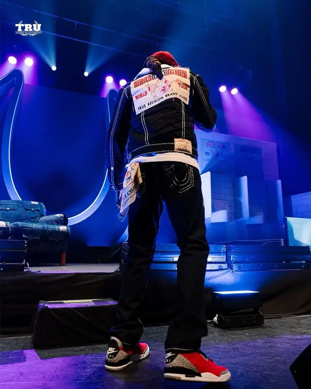 2 Chainz outfit in True Religion, Louis Vuitton, and 2 Chainz Merch, 2021