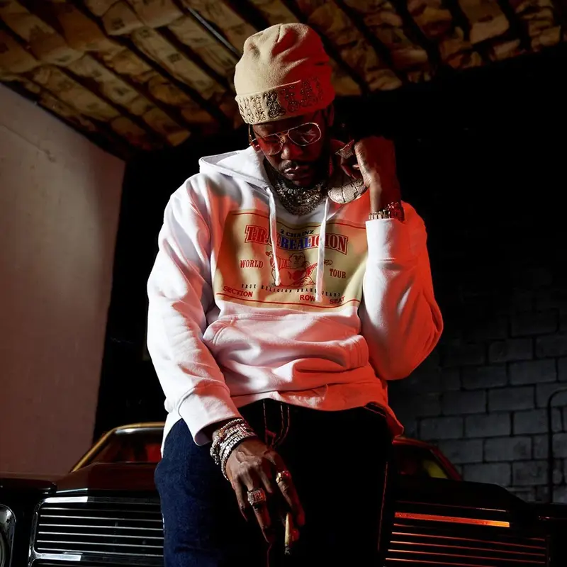 2 Chainz outfit in True Religion, Supreme, and 2 Chainz Merch, 2021