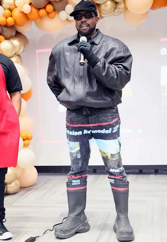 Kanye West outfit in Crocs, Balenciaga, and Kanye West Merch, 2021