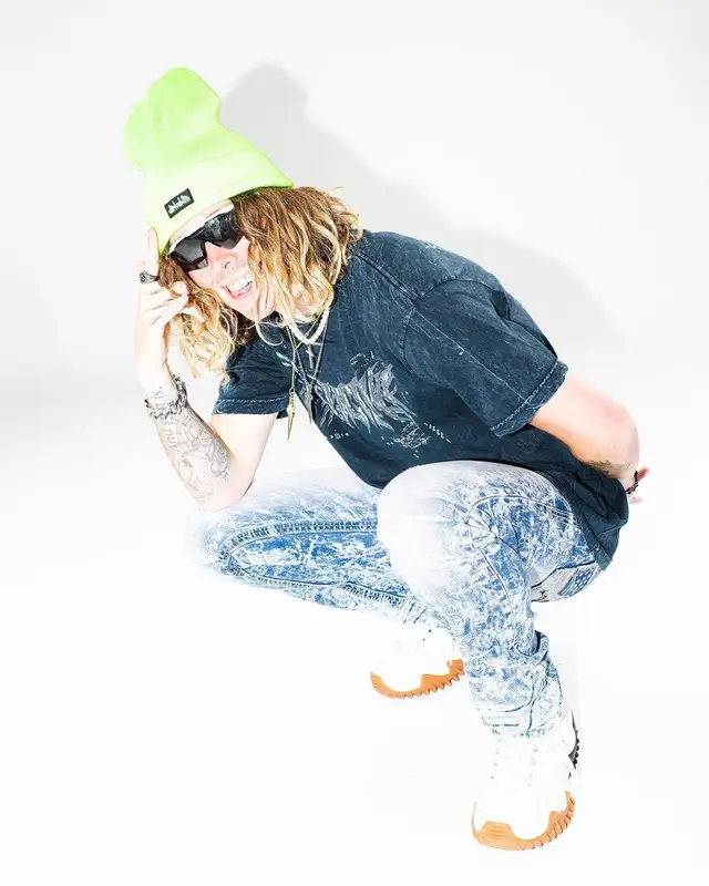 Jeris Johnson outfit in Affliction Clothing, Converse, and Oakley, 2021