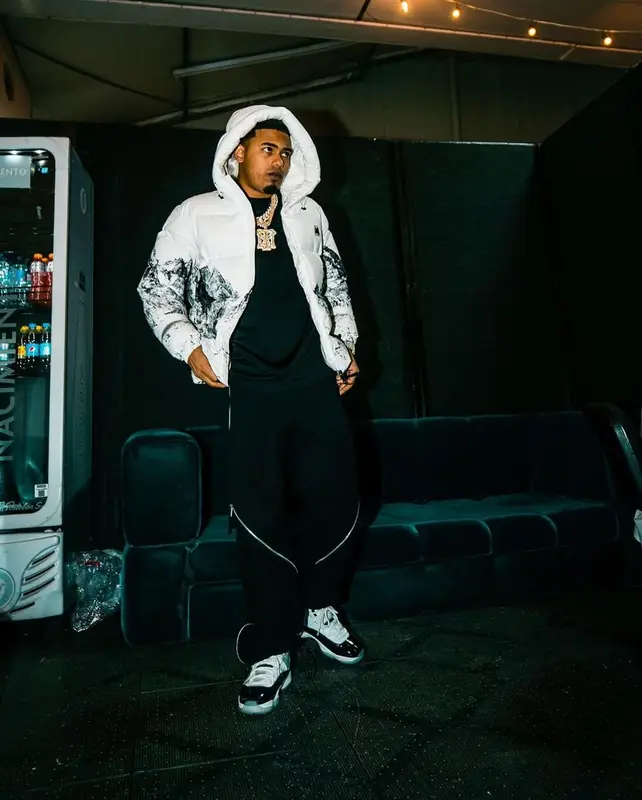 Myke Towers outfit in Moncler, Bottega Veneta, and Jordan, 2021
