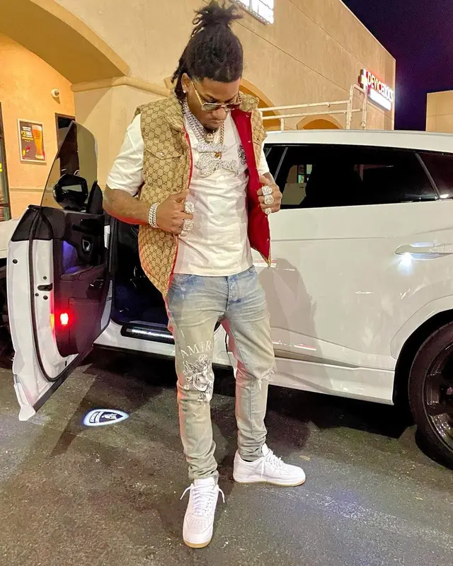 CJ So Cool outfit in Gucci, Amiri, and Louis Vuitton, 2021