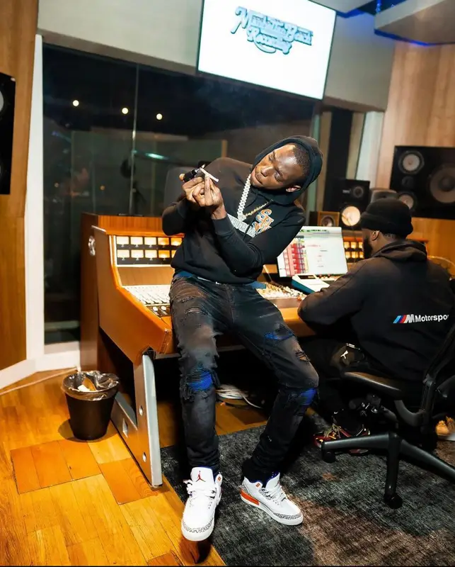 Bobby Shmurda outfit in Amiri, Jordan, and Louis Vuitton, 2021