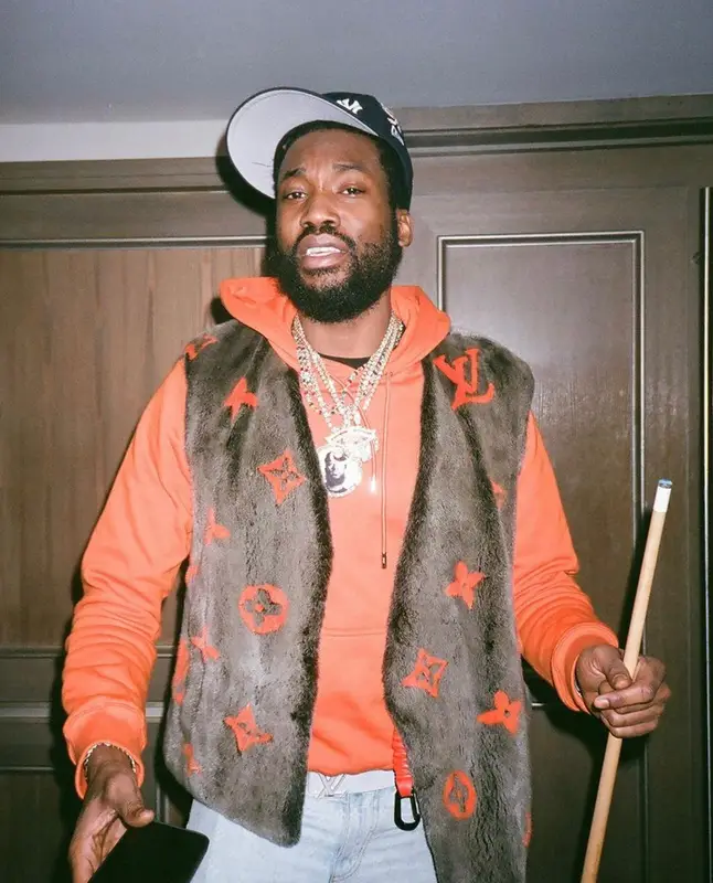 Meek Mill outfit in Louis Vuitton, NBA, and Nike, 2021