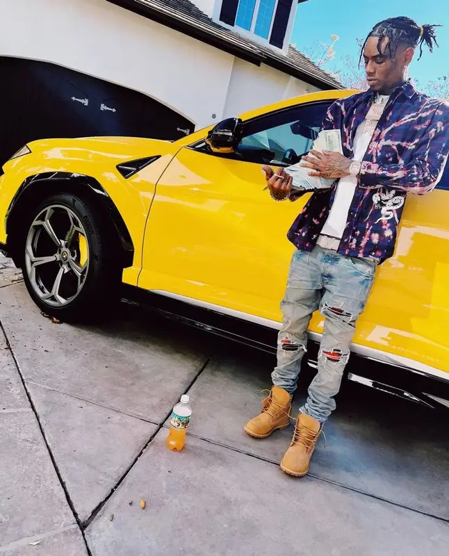 Soulja Boy outfit in FashionNova, Amiri, and Louis Vuitton, 2021