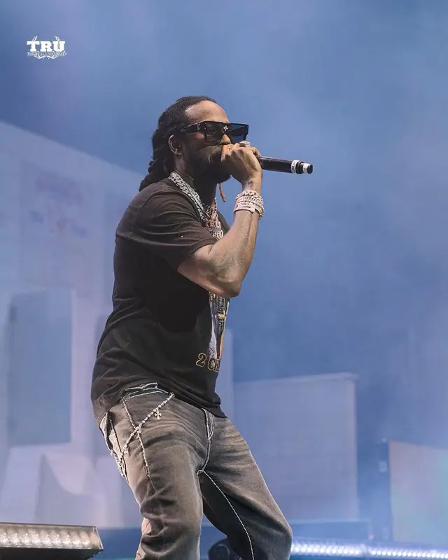 2 Chainz outfit in True Religion, Louis Vuitton, and 2 Chainz Merch, 2021