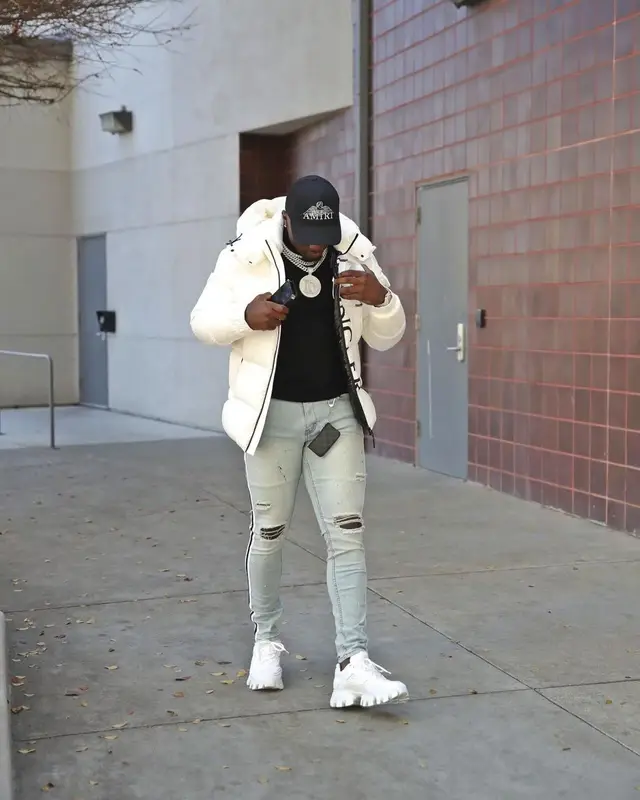 Deebo Samuel outfit in Moncler, Prada, and Amiri, 2021