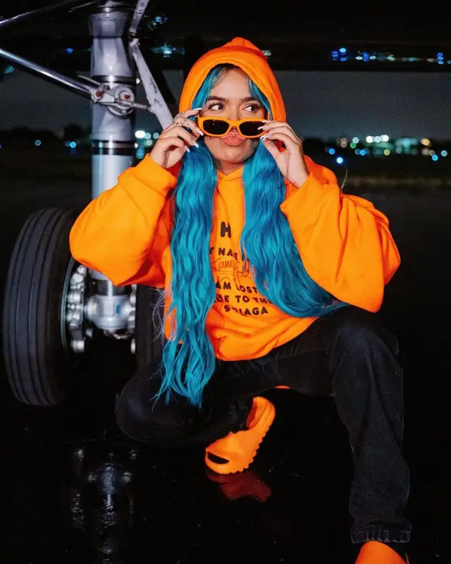 Karol G outfit in Balenciaga, Louis Vuitton, and Yeezy, 2021