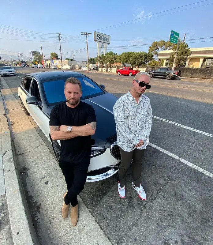 J Balvin outfit in Comme Des Garcons, Louis Vuitton, and   Kaws, 2021