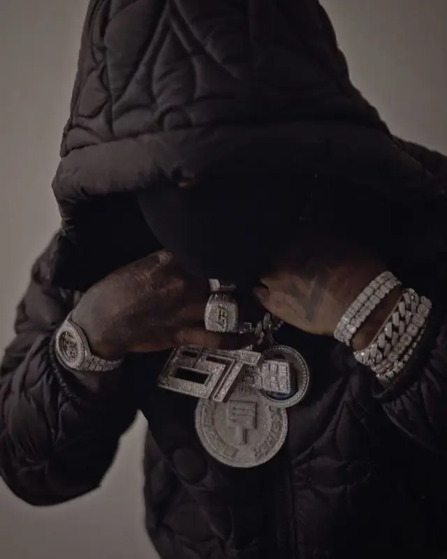 EST Gee outfit in Louis Vuitton, Denim Tears, and Amiri, 2021