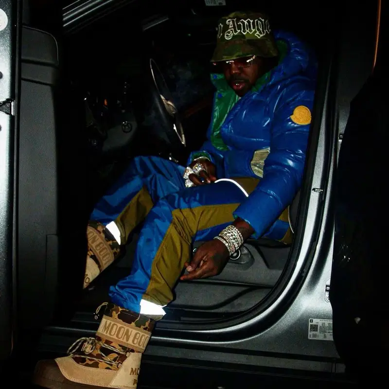 EST Gee outfit in Moncler, Cartier, and Palm Angels, 2021