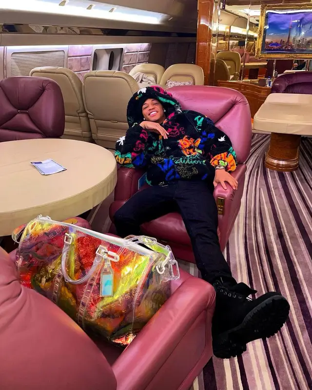 YK Osiris outfit in Zara, Amiri, and Louis Vuitton, 2021