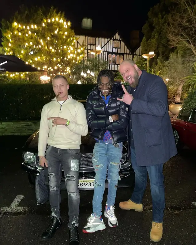 Russ Millions outfit in Moncler, Louis Vuitton, and Amiri, 2021