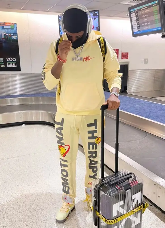 Fabolous outfit in Jordan, Rimowa, and Off-White, 2021