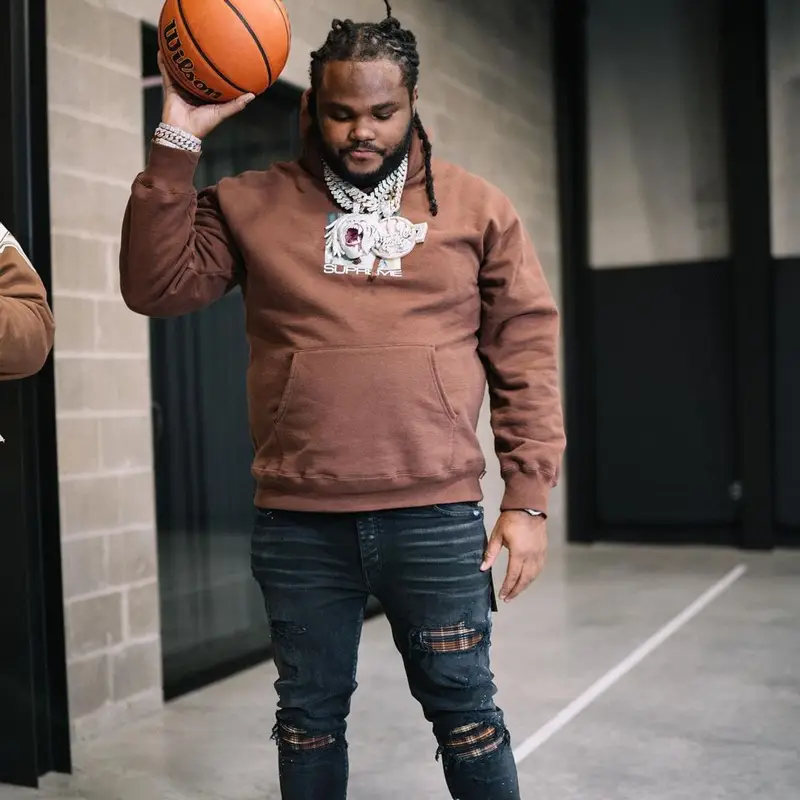 Tee Grizzley outfit in Supreme, Amiri, and Nike, 2021